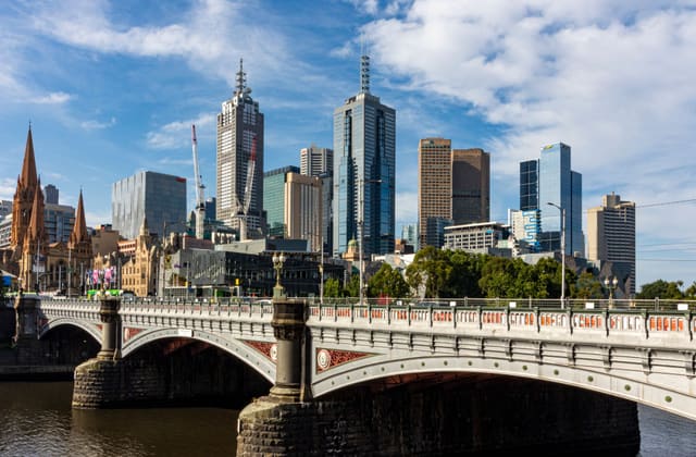 Stunning view of Melbourne's skyline featuring Princes Bridge and Yarra River.