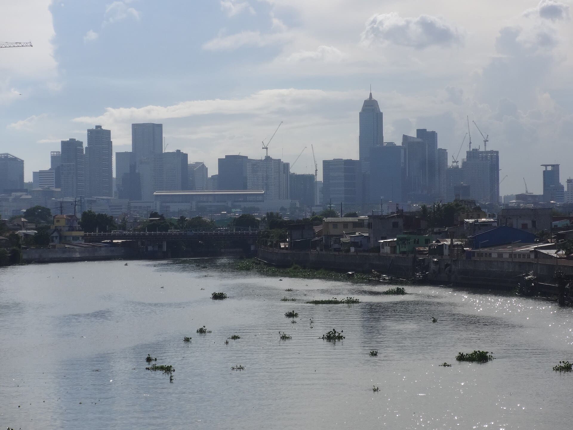 Bonifacio Global City skyline as seen from Pasig River. BGC is one of the primary commercial centers iin Metro Manila.