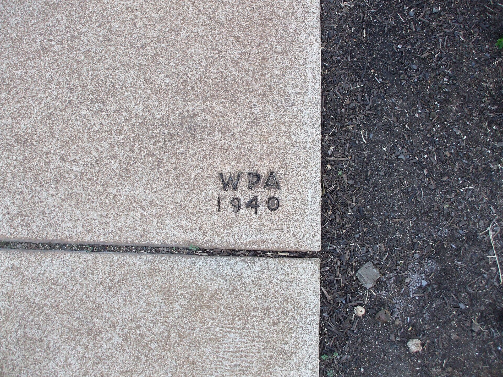Section of WPA-made sidewalk "signature."
