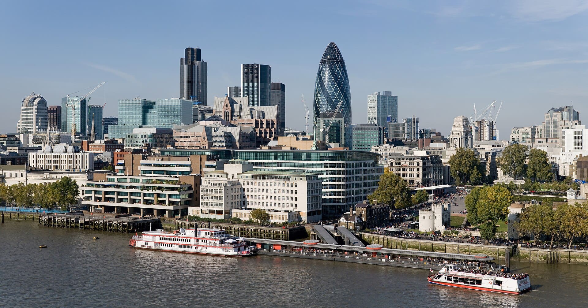 The City of London skyline as viewed toward the north-west from the top floor viewing platform of London City Hall on the southern side of the Thames. In the foreground: Dixie Queen and Millennium Time at Tower Millennium Pier. This is a 5 segment panoramic image taken by myself with a Canon 5D and 24-105mm f/4L IS lens.