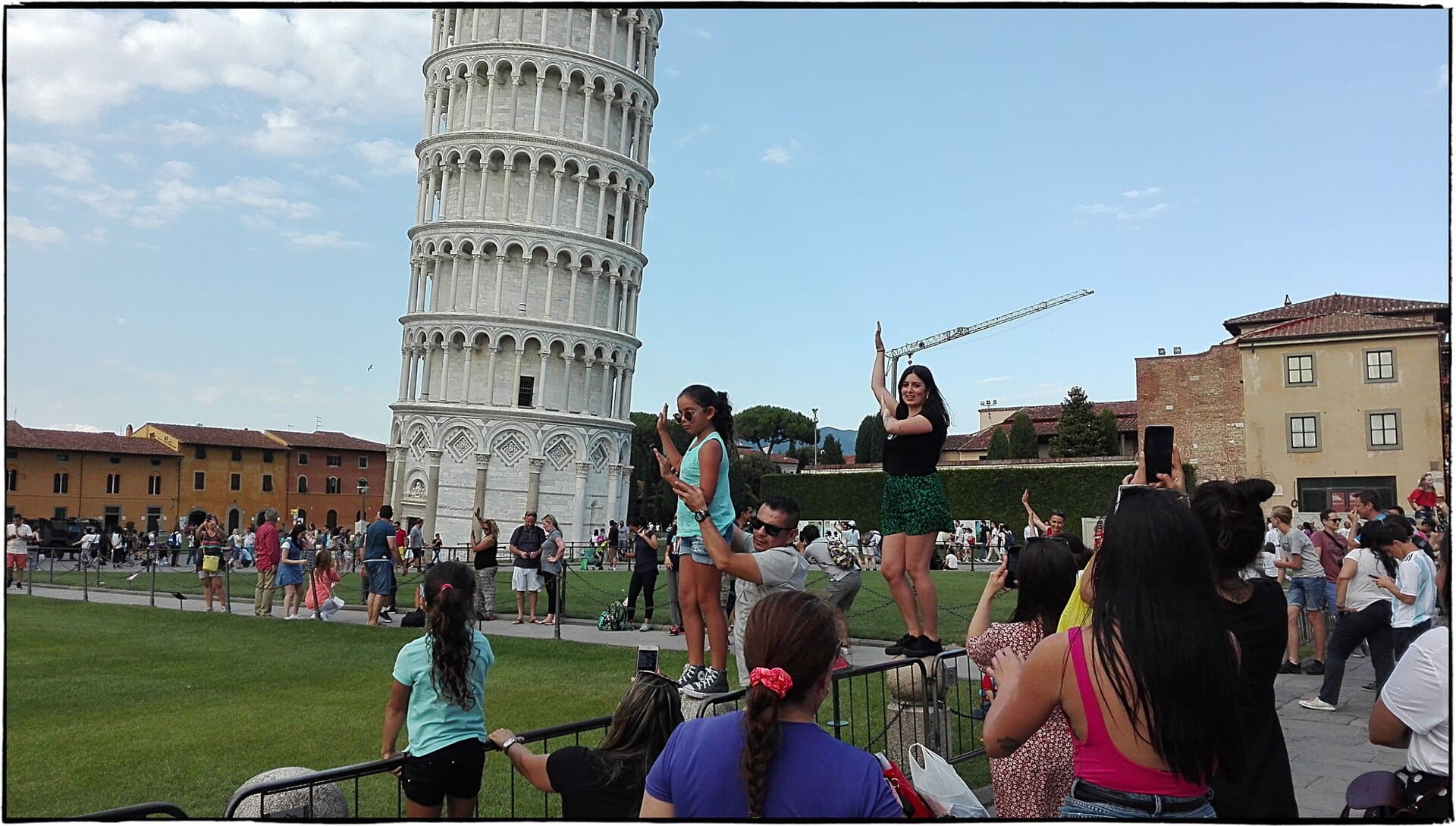 500px provided description: Everyone Wants To Save The Pisa Tower [#sky ,#city ,#people ,#italy ,#tower ,#cityscape ,#silhouette ,#green ,#skyline ,#italian]