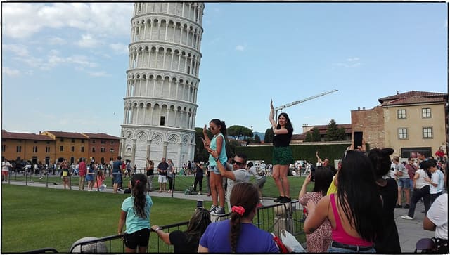 500px provided description: Everyone Wants To Save The Pisa Tower [#sky ,#city ,#people ,#italy ,#tower ,#cityscape ,#silhouette ,#green ,#skyline ,#italian]
