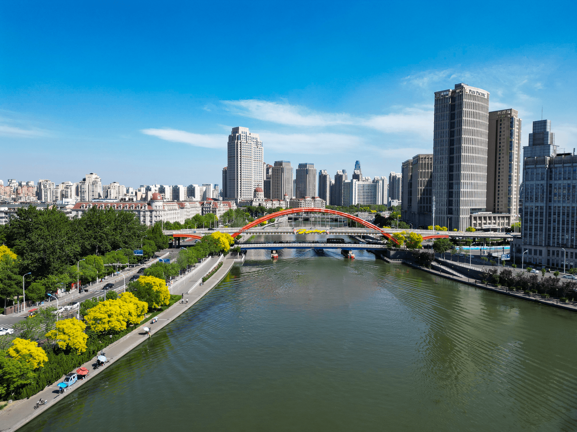 Stunning aerial view of Tianjin cityscape, featuring the Haihe River and modern architecture.