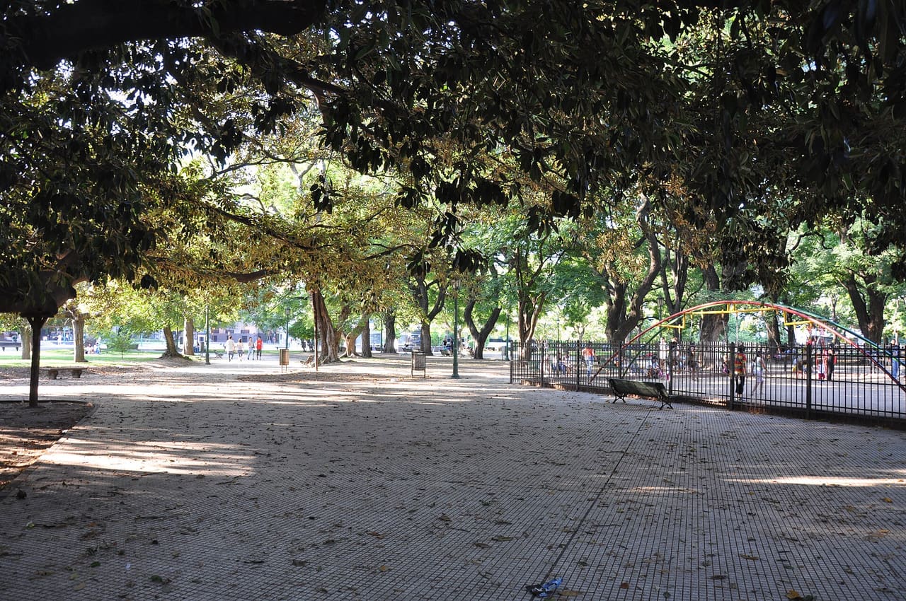Plaza San Martín (Spanish: San Martín Square) is a park located in the Retiro neighbourhood of Buenos Aires. A succession of colonial Spanish governors had their official residences built on what today is the plaza and, in 1713, the land was sold to the British South Sea Company. The South Sea Company operated their slave trade out of the former governor's residence and a fort and bullring were later built nearby. The land was the site of Gen. John Whitelocke's 1807 defeat upon King George III's second attempt to conquer Buenos Aires, whereby the area became known as the "Field of Glory". The Revolution of 1810 brought an autonomous government to Buenos Aires, which entrusted the Mounted Grenadiers to José de San Martín and allowed him to establish his main barracks at the plaza. An 1813 resolution abolished the slave trade in the United Provinces of the Río de la Plata and the slave quarters were shuttered. Following his decisive military victories, Gen. San Martín was forced into exile in 1824 for political reasons; but a reappraisal of his place in history led to his becoming nearly eponymous in Argentina after his passing in 1850. Accordingly, French sculptor Louis-Joseph Daumas was commissioned in 1862 to create an equestrian statue of the hero of the Wars for Independence and the square was renamed in his honor in 1878, upon the hundredth anniversary of his birth. Monument to José de San Martín, the plaza namesake. Following remodeling works by British architect Edward Taylor and Argentine architect José Canale, the fort, bullring and other buildings were demolished in 1883 by order of Mayor Torcuato de Alvear, converting the area into a plaza. Numerous Ombú, Linden and Floss Silk trees were planted. The same administration also shaped the Plaza de Mayo, nearby and in 1889 French urbanist Charles Thays was commissioned to give the plaza its approximate current form (among numerous other designs he left Argentina over the next twenty years). The plaza became the preferred surroundings for some of Argentina's wealthiest landowners around 1900. Three architecturally significant mansions facing the plaza surviving today were the Beaux Arts Anchorena Palace (today the ceremonial annex of the Foreign Ministry), the Second Empire Paz Palace (today the Military Officers' Association) and the Neogothic Haedo palace (today the Secretariat of Environmental Policy). 'Monumento a los Caídos en Malvinas' (Monument for the fallen in the Falklands War) is located in Plaza San Martin The plaza in 1909 was the site for the inaugural of both the first premier hotel in Argentina (the Plaza) and of the new National Museum of Fine Arts, for which the glass and steel pavilion used at the 1889 World's Fair in Paris was enlisted; structurally inadequate, the pavilion was demolished in 1932, however. Plaza San Martín and its surroundings acquired their current physionomy in 1936, when Charles Thays' son, Carlos León Thays, designed the esplanade surrounding the monument and when the 33-story Art Deco Kavanagh building was completed. Though the surrounding area has since seen much of its older architecture replaced by highrises (notably the 1975 Pirelli building), the plaza has remained timeless. Its western section was separated to make way for a rerouting of Maipú Street in 1972; but President Néstor Kirchner ordered the change reverted in 2004, in response to long-standing appeals by neighbours and friends of the park [Wikipedia.org]