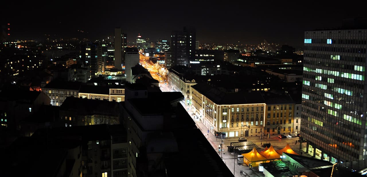 Night skyline of Ljubljana (capital of Slovenia), taken from the Nebotičnik. In the middle Slovenska street continues to Dunajska street.