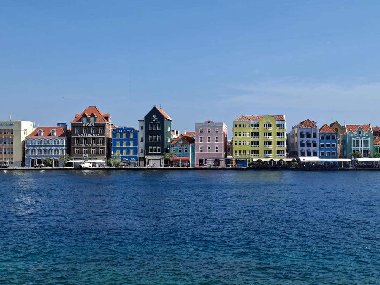 Vibrant Dutch colonial buildings along the waterfront in Willemstad, Curacao.