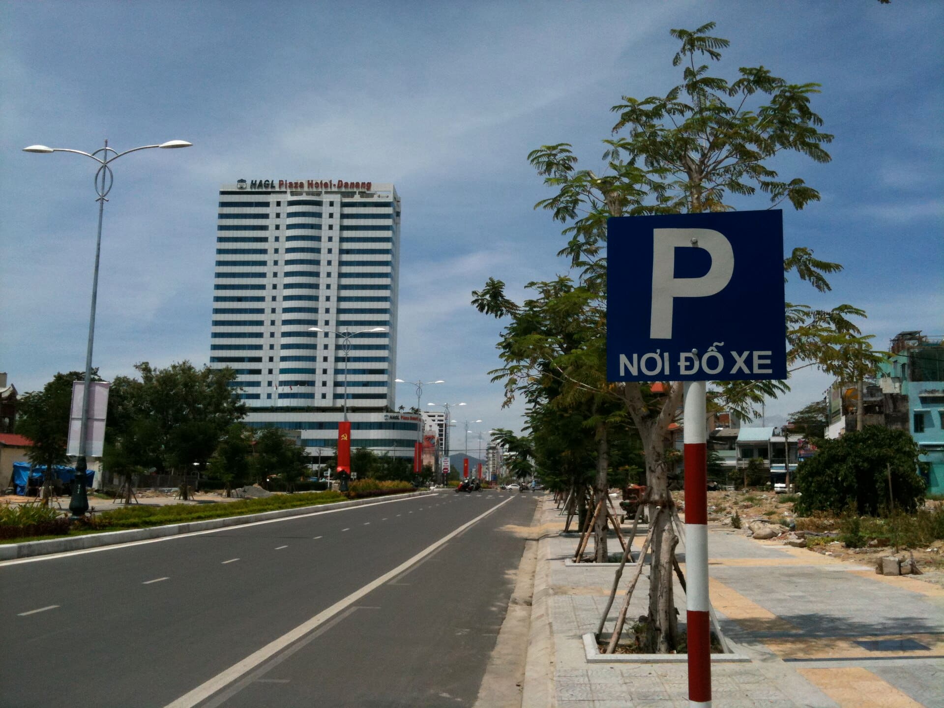 Looking up Nguyen Van Linh Street towards Da Nang Int'l Airport; the HAGL Plaza Hotel dominates the skyline.