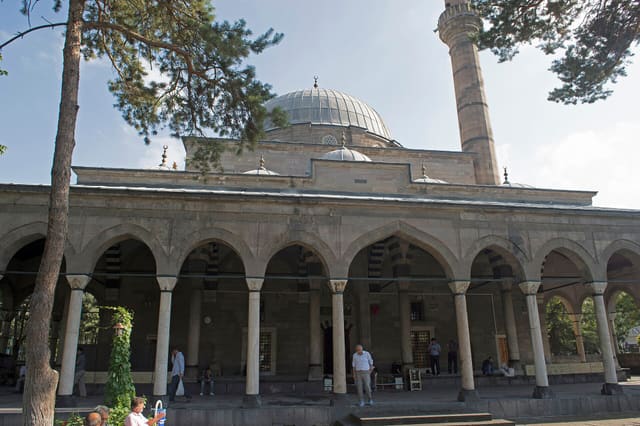 The site of the city information has, translated and somewhat adapted: This mosque, which was built by Mimar Sinan in 1573, whose hometown was Kayseri and whose real name was Hacı Ahmet Paşa Mosque, was named "Kurşunlu Mosque" due to its central dome covered with lead. The mosque is the only [remaining?] work of Mimar Sinan, who made 12 works in the city, Kurşunlu Mosque and Fountain 03 in Kayseri. It attracts attention with its interior decorations, pulpit and domed fountain carried by pointed arches stepping on eight columns in the courtyard. Kurşunlu Mosque, a classical Ottoman period architectural work, is one of the most beautiful mosques in Kayseri in terms of decoration. The last congregation place [the portal in front] of the mosque, built with cut stone, has double porticoes, as in Mimar Sinan's Mihrimah, Atik Valide and Eminönü Rüstem Pasha mosques in Üsküdar, Istanbul.
