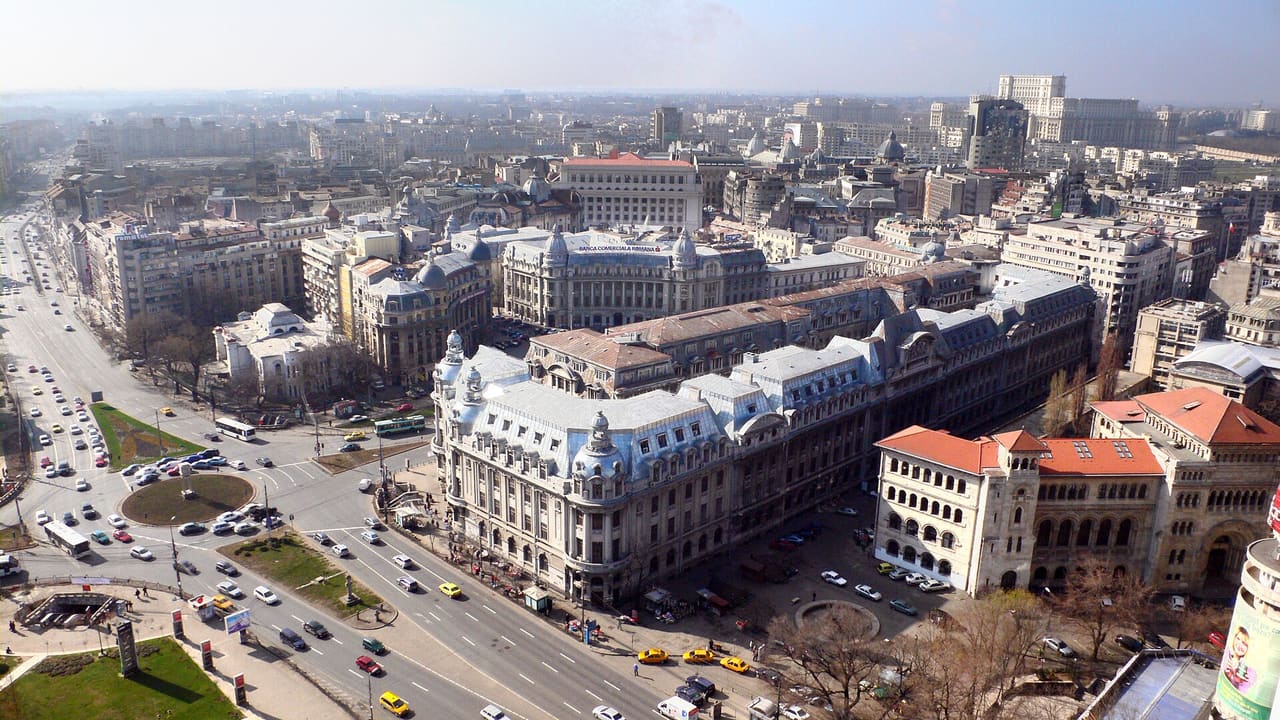 Bucharest Skyline, view from the Intercontinental Hotel In the front view: University Square, Bucharest Faculty of Letters and the Bucharest Faculty of Architecture. In the back view: BCR - Romanian Commercial Bank building, Bucharest Financial Plaza tower and The Palace of the Parliament.