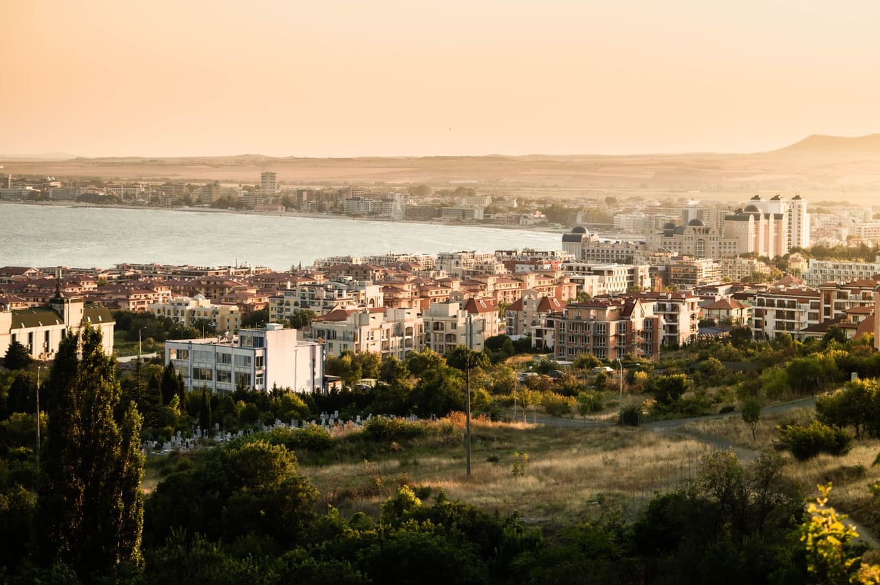 Picturesque view of Sunny Beach, Bulgaria, showcasing coastal cityscape at sunset.