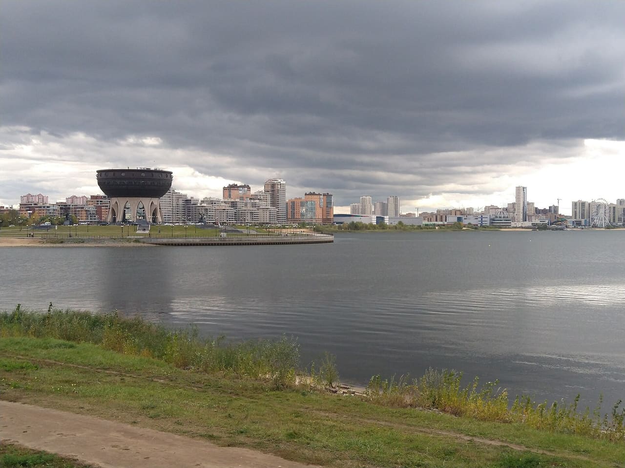View across the Kazanka River towards the Kazan Family Center and the skyline of Kazan, Tatarstan, Russia, 19 September 2020.