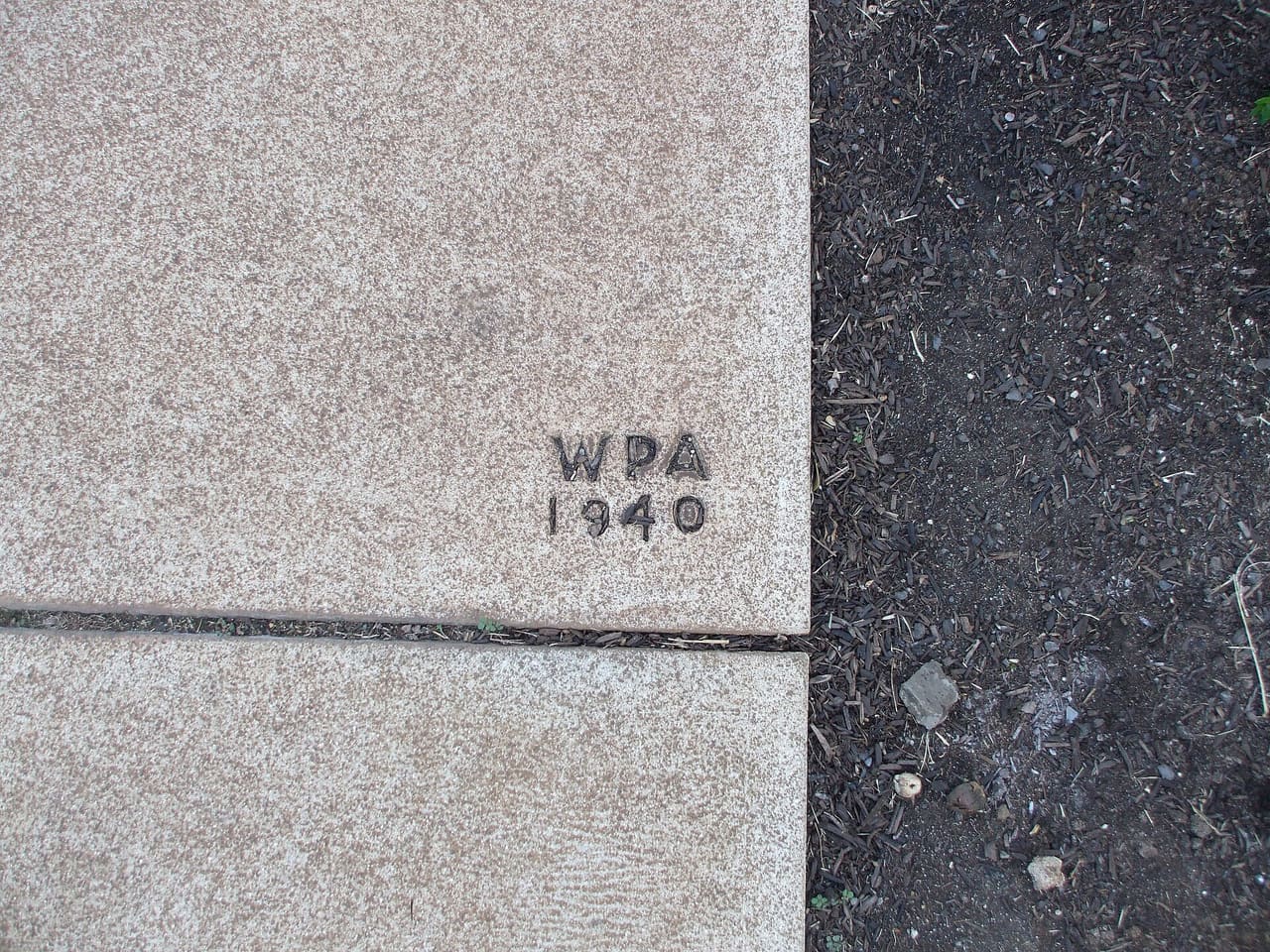 Section of WPA-made sidewalk "signature."
