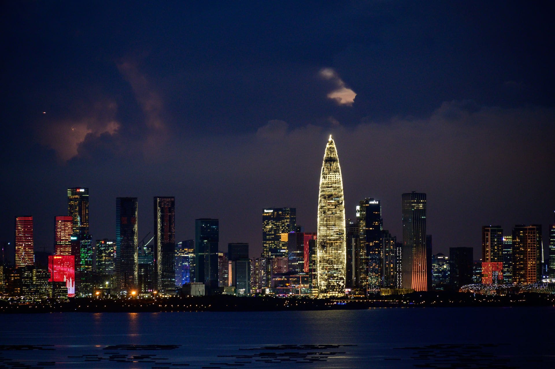 A breathtaking cityscape at night, showcasing illuminated skyscrapers and a vibrant skyline.