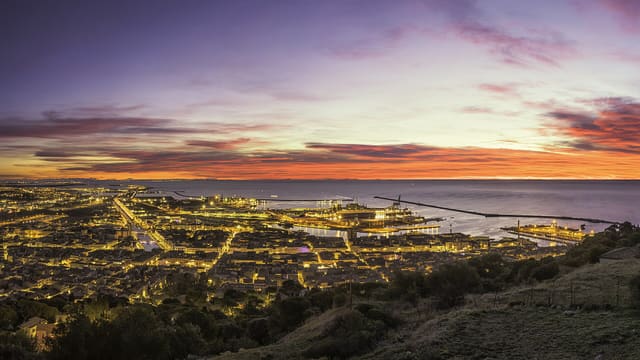 A part of the town and harbour of Sète at dawn, taken from the Mount Saint Clair, France.