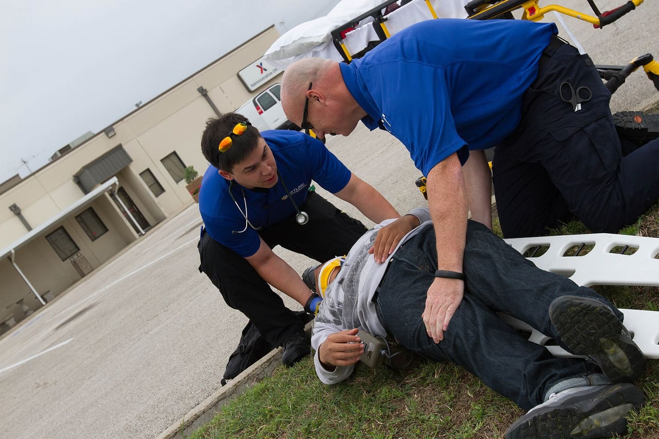 Skyline Emergency Service paramedics place a simulated casualty from the scene of a replicated train derailment at Fort Hood, Texas, May 20, 2015. The scenario was part of a large force protection exercise that occurs annually, involving local and regional emergency services. (U.S. Army photo by Sgt. Tracy R. Myers, 14th Public Affairs Detachment) Unit: 14th Public Affairs Detachment